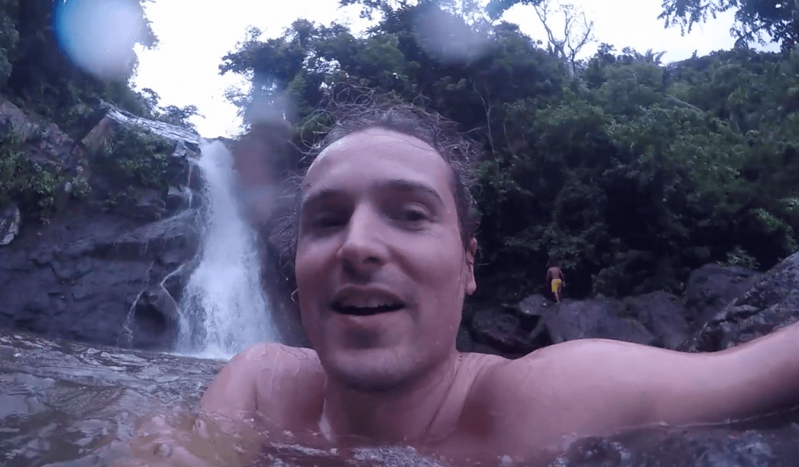 lennythroughparadise in the water of maribina falls waterfall in catanduanes island philippines